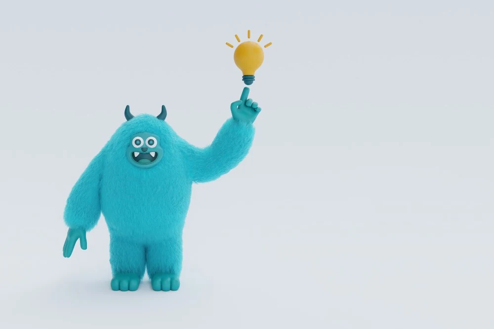 A friendly blue monster pointing up at a glowing lightbulb, cheering on new ideas