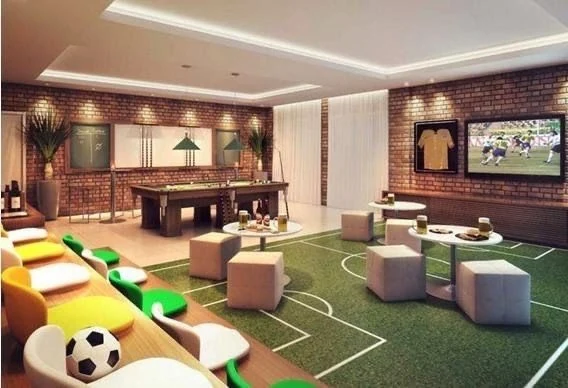A football-themed lounge with a pool table and pitch-pattern carpet, used by Agni and Vayu